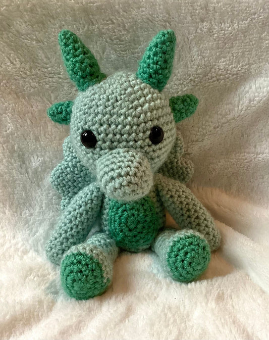 Green cute crochet dragon